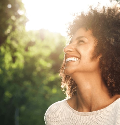 Woman smiling outdoors