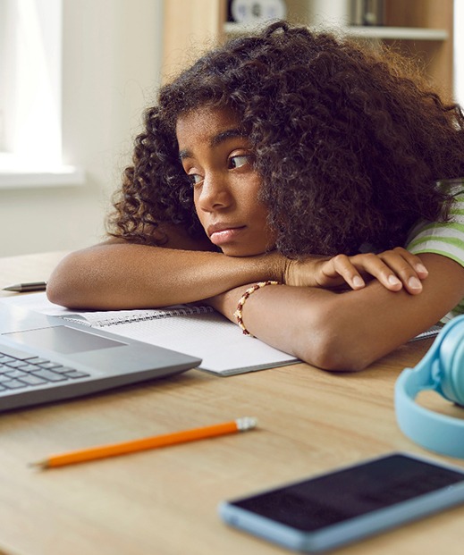 Girl struggling to do her schoolwork