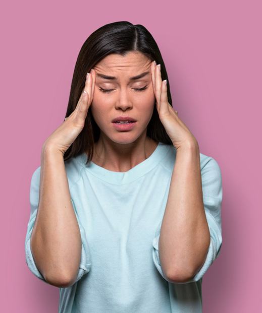 Woman with hands on her hand, suffering from anxiety