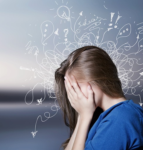 Woman covering her face, feeling anxiety