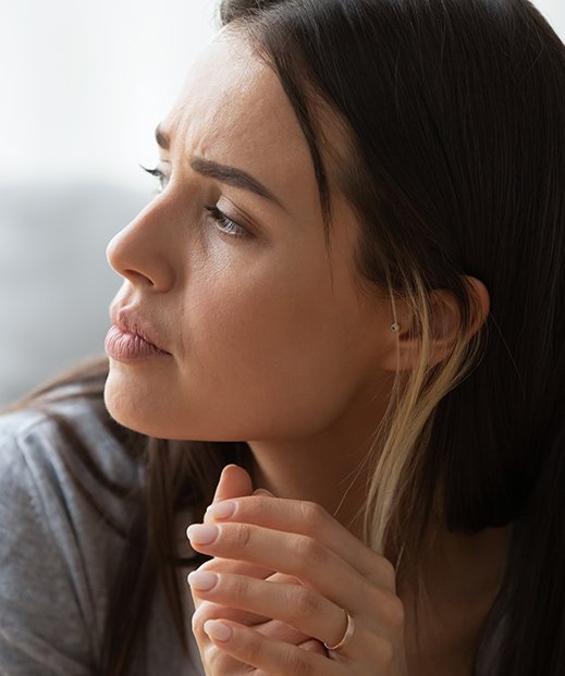 Concerned woman looking out the window