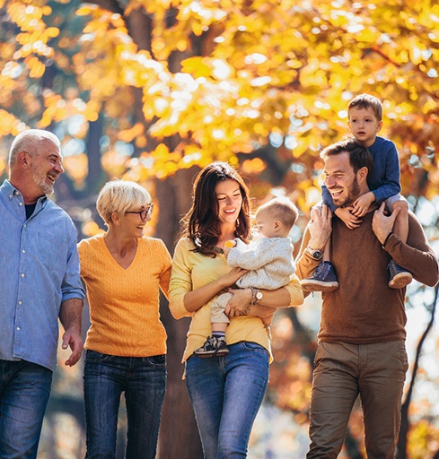 Happy family walking together outdoors