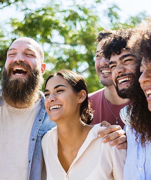 Group of happy people smiling outdoors
