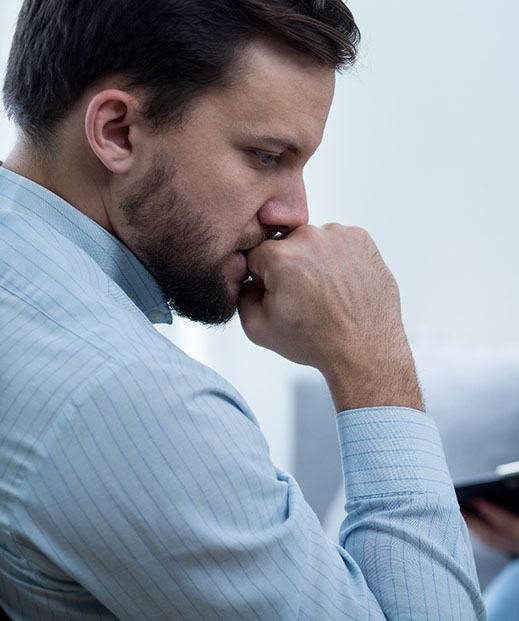 worried man talking to counselor 