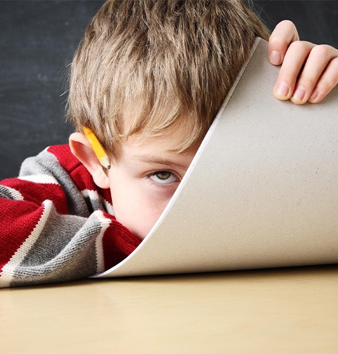 Frustrated boy struggling with homework