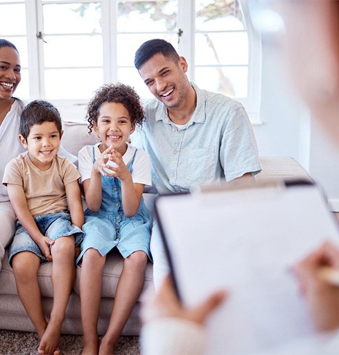 Parents and kids attending therapy session