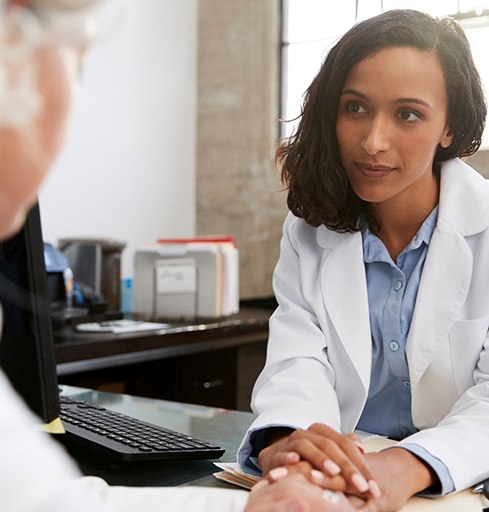 Doctor talking to senior patient