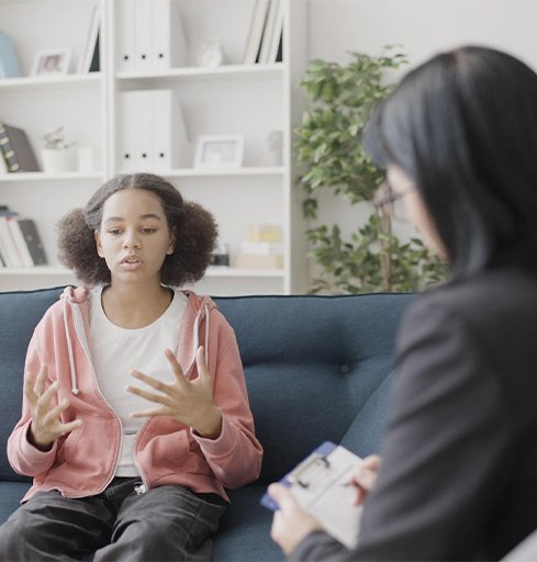 Teen girl expressing herself during talk therapy