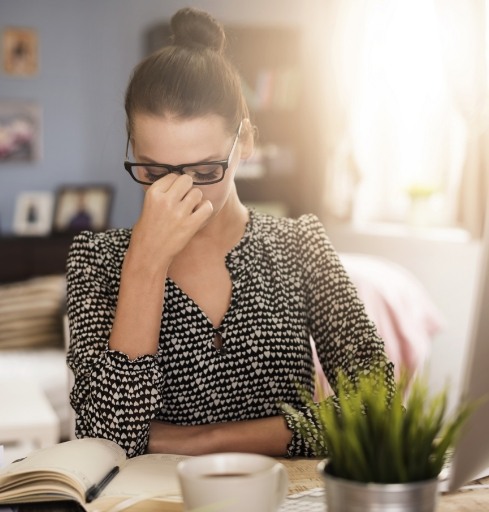 Woman struggling to concentrate due to attention deficit hyperactivity disorder