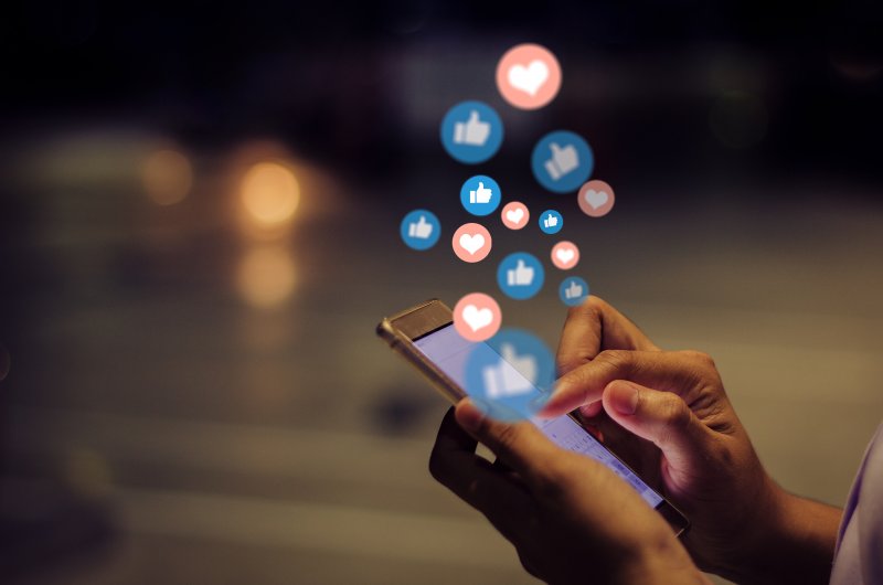 young woman using social media on her phone 