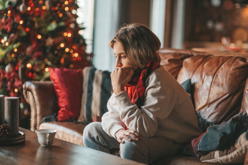 a woman struggling with stress and depression during the holidays