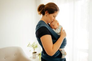 Mother kissing her baby’s head