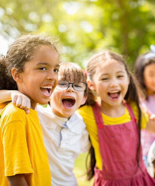 group of happy kids playing outside in park v1